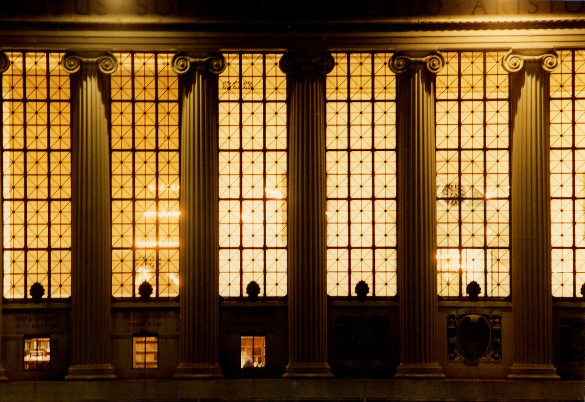 The lit windows and columns of Butler Library