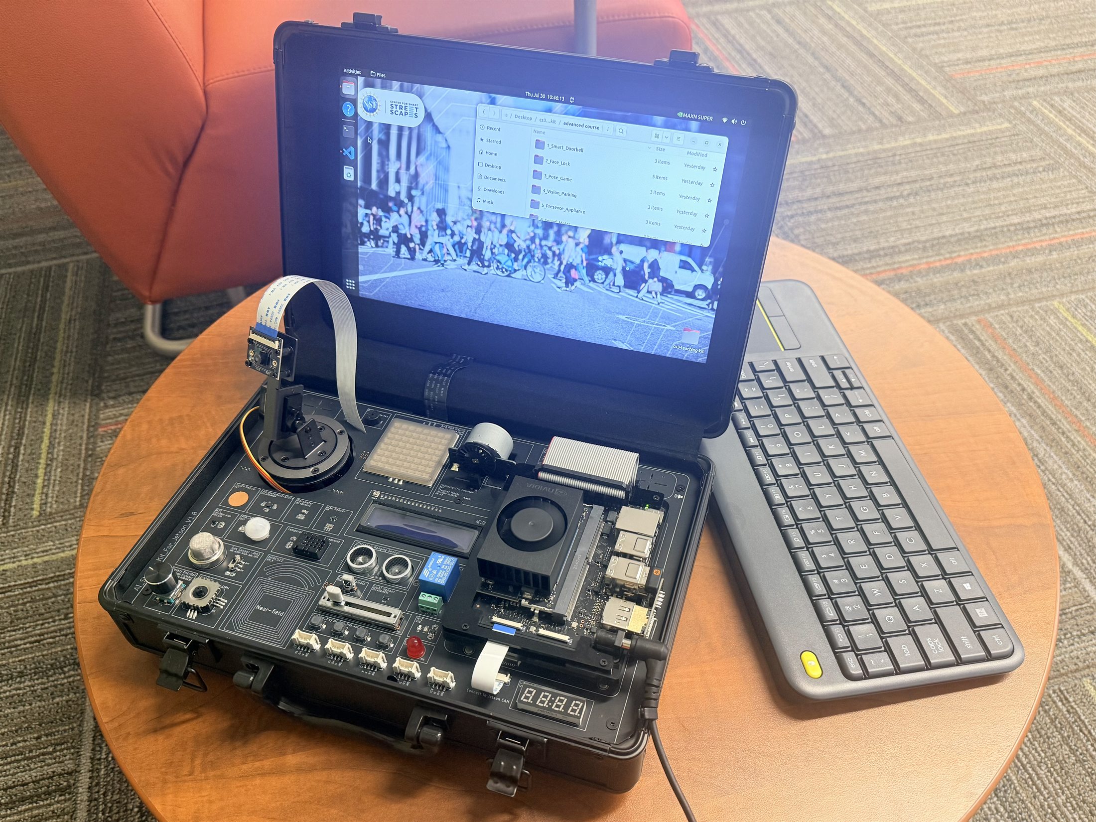 Open CS3 AI Teaching Kit showing a Jetson Orin Nano Super, camera, sensor board, display, and keyboard